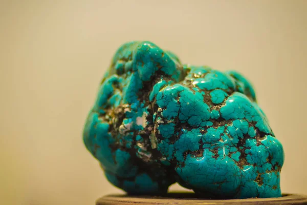 Turquoise stone specimen from mining for education. Turquoise is an opaque, blue-to-green mineral that is a hydrated phosphate of copper and aluminium and veined or mottled with brown or black oxides.