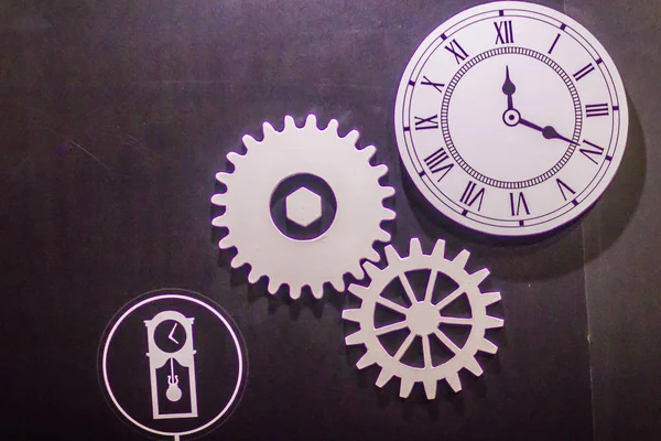 Clock and gears concept. Clock gears are used to allow the clock to run for longer time periods without winding.