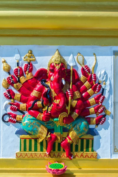 Colorful Ganesha Hindu god avatar images in stucco low relief white wall at the public Wat Samarn temple, Chachoengsao, Thailand. Ganesha also known as Ganapati, Vinayaka, Pillaiyar and Binayak.