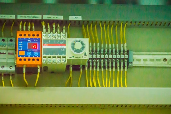 Connectors in the electrical main distribution board unit ,circuit of control panel with selector switch ,automatic switch and circuit breaker. Electrical wiring in the MDB and control panel concept.