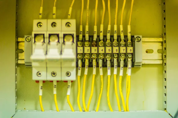 Connectors in the electrical main distribution board unit ,circuit of control panel with selector switch ,automatic switch and circuit breaker. Electrical wiring in the MDB and control panel concept.