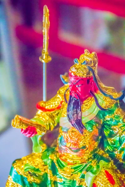 Beautiful golden Guan Yu statue in the public Chinese temple. Guan Yu is the god warrior in the Three Kingdoms period.