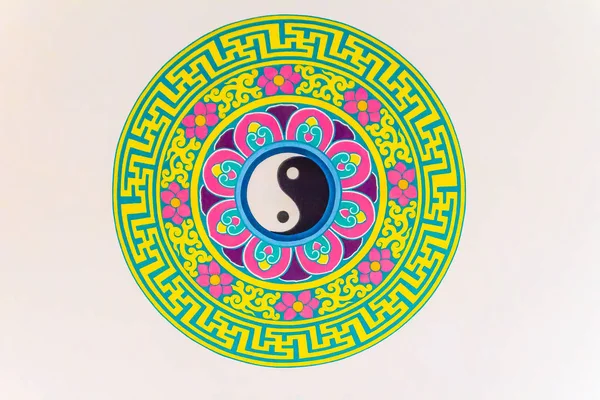 Golden symbol of Yin - Yang on the ceiling of Chinese temple. Yin and Yang is that all things exist as inseparable and contradictory opposites, for example, female-male, dark-light and old-young.