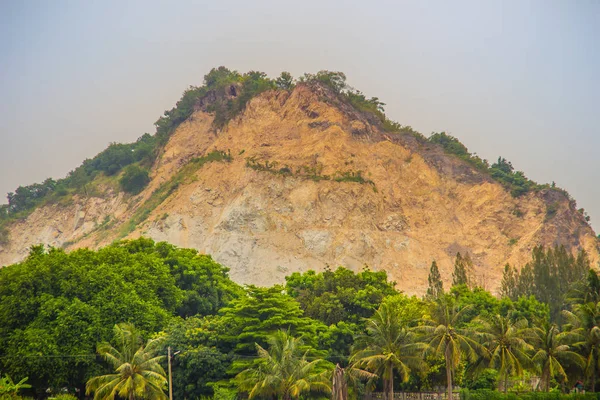 Environmental impact of quarrying and mining in the mountain made erosion in the environment, formation of sinkholes, loss of biodiversity, and contamination of soil. A quarry cuts into an entire hill