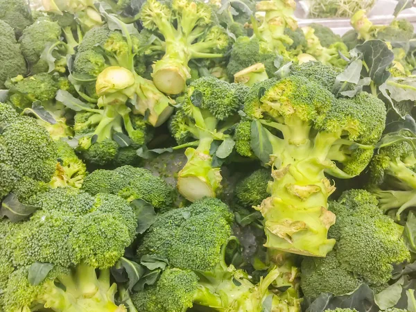 Green broccoli for sale in the supermarket. Broccoli is an edible green plant in the cabbage family whose large flowering head and stalk is eaten as a vegetable.