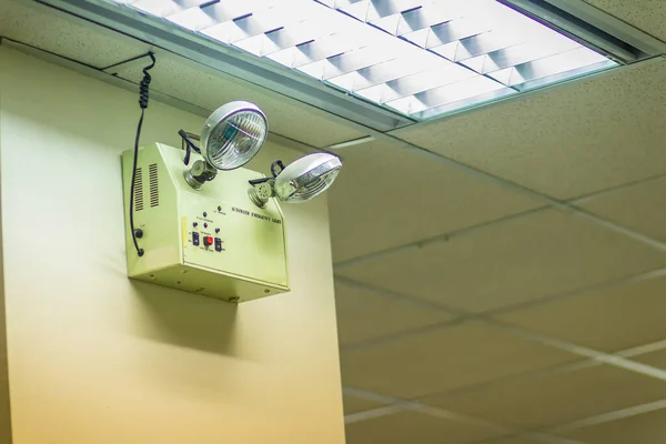 Automatic emergency lights with two lamps in the office. Automatic flood lights, emergency lights, hallway lights