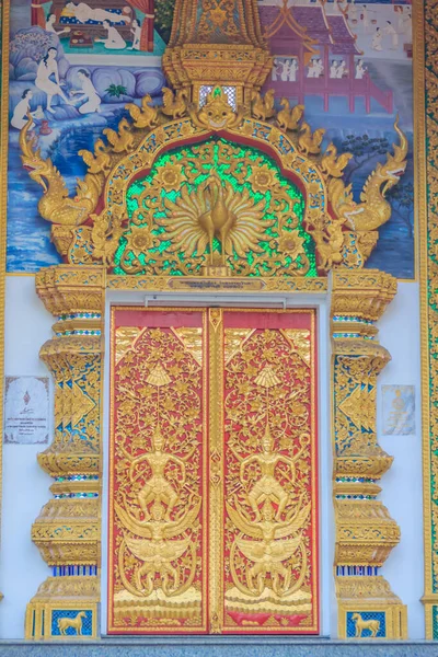 Beautiful big buddha image at Wat Phra That Doi Kham. Chiang Mai, Thailand. Wat Phra That Doi Kham (Wat Doi Kham or the Golden temple) is located at the top of a hill to the south west of the city.