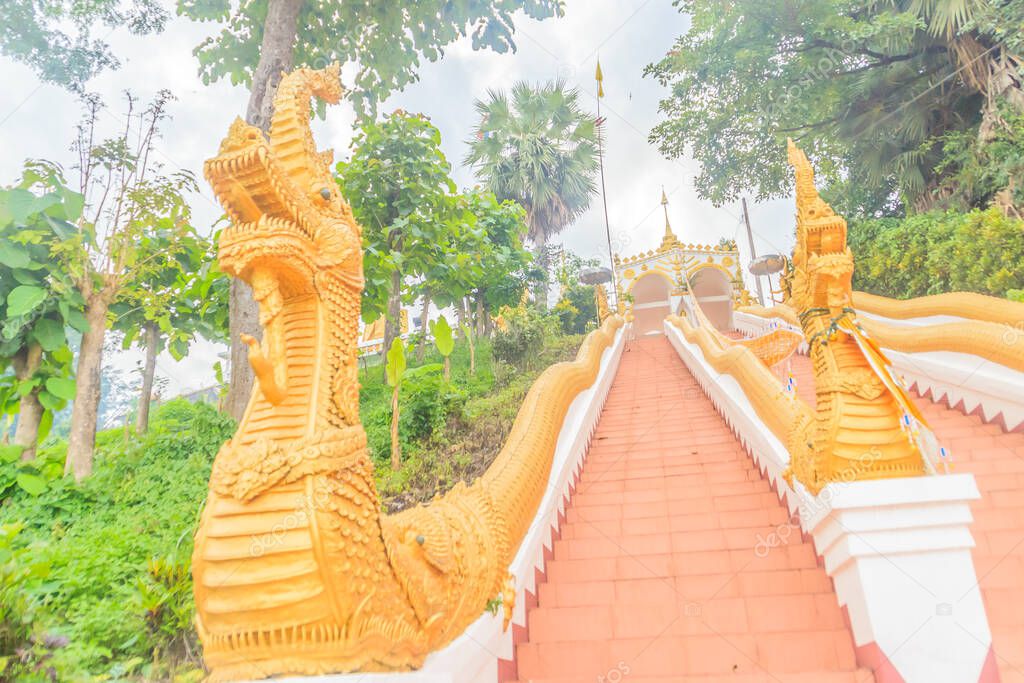 Beautiful nagas staircase upward to the temple at Wat Phra That Chom Sak, thai public Buddhist temple. Located in Mueang, Chiang Rai Province, Built during the Yonok Chai Buri Si Chiang Saen period.