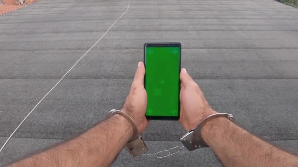 Young Man Road Watching Green Mock Screen Smartphone Vertical Mode — Stock Video