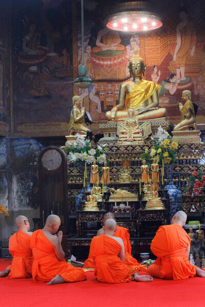 Men perform ordination requests according to Buddhism. In the chapel for ordaining monks at the temple., Thailand.