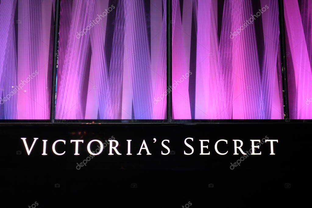 Shanghai/China-Oct.2019: bright shop sign of VICTORIA'S SECRET at night. Beautiful purple pink window display. Famous female underwear brand