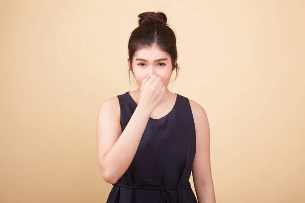 Young Asian Woman Holding Her Nose Because Bad Smell Beige — Stock Photo, Image