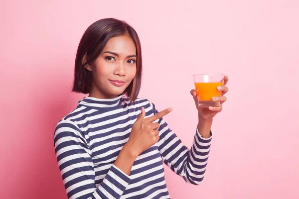 Young Asian Woman Point Orange Juice Pink Background — Stock Photo, Image