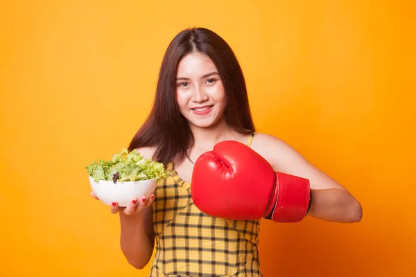 Young Asian Woman Boxing Glove Salad Yellow Background — Stock Photo, Image