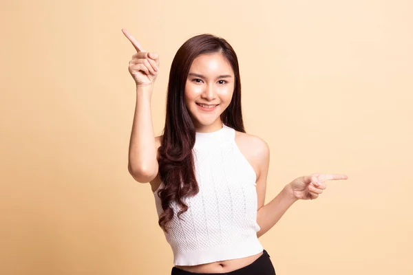 Young Asian Woman Point Two Hands Beige Background — Stock Photo, Image