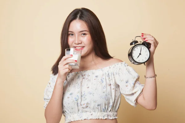 Healthy Asian Woman Drinking Glass Milk Hold Clock Beige Background — Stock Photo, Image