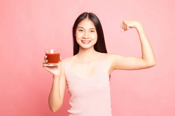 Strong healthy Asian woman with tomato juice. — Stock Photo, Image