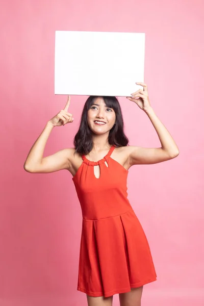 Jeune asiatique femme point à vide signe . — Photo