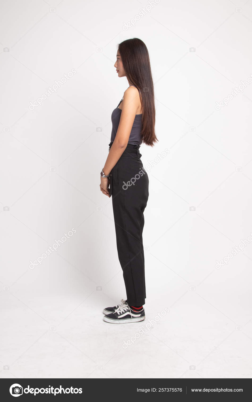 The shape of a real woman. Side view of a curvy young woman looking away.  Stock Photo by YuriArcursPeopleimages