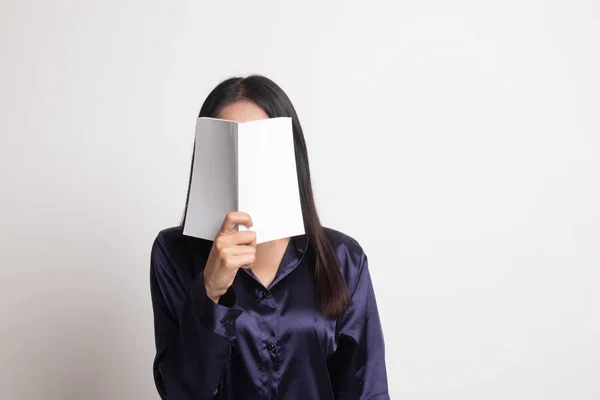 Young Asian woman with a book cover her face. — Stock Photo, Image