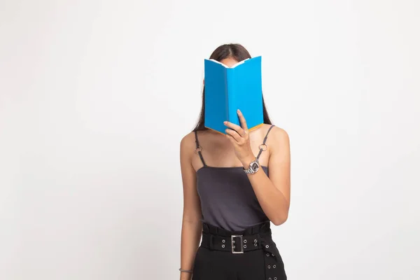 Young Asian woman with a book cover her face. — Stock Photo, Image