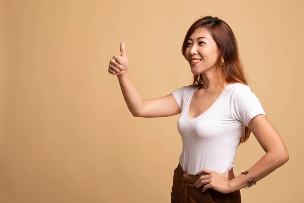 Asian woman thumbs up  and smile.