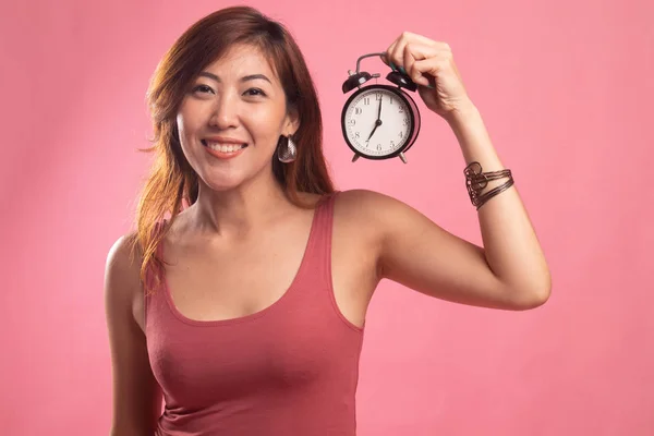 Joven asiático mujer con un reloj. —  Fotos de Stock