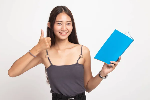 Junge asiatische Frau Daumen nach oben mit einem Buch. — Stockfoto