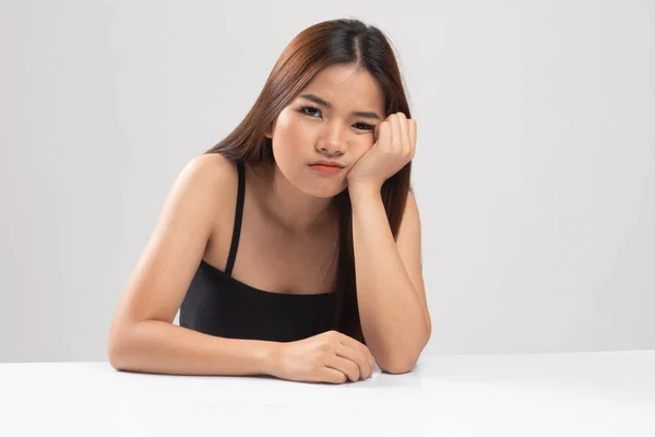 Asian girl is getting bore. — Stock Photo, Image