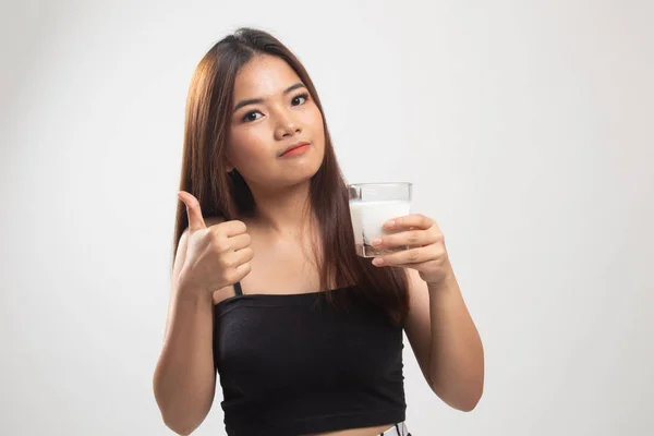Healthy Asian woman drinking a glass of milk thumbs up. — Stock Photo, Image