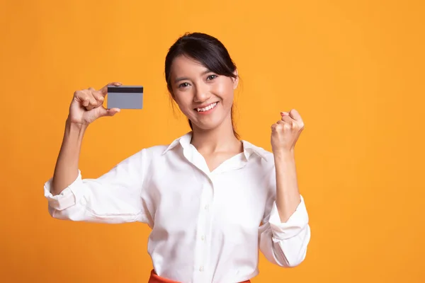 Young Asian woman fist pump with blank card.