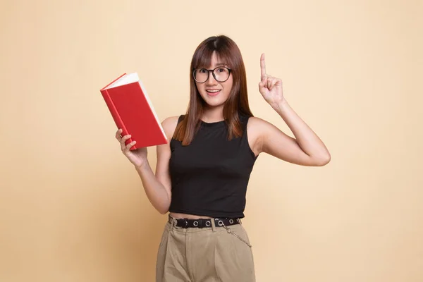 Young Asian woman with a book have an idea. — Stock Photo, Image