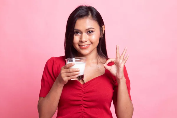 Healthy Asian woman drinking a glass of milk show OK sign. — Stock Photo, Image