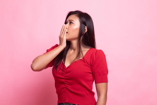 Sleepy young Asian woman yawn.