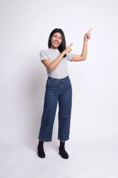 Full body of beautiful young asian woman pointing up.