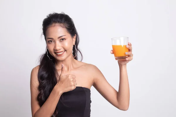 Young Asian woman thumbs up drink orange juice.