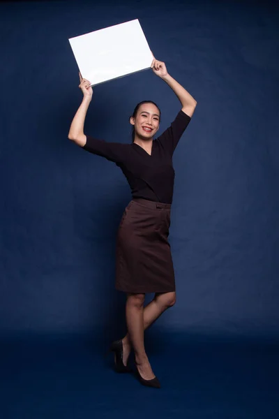 Young Asian woman with white blank sign. Stock Photo