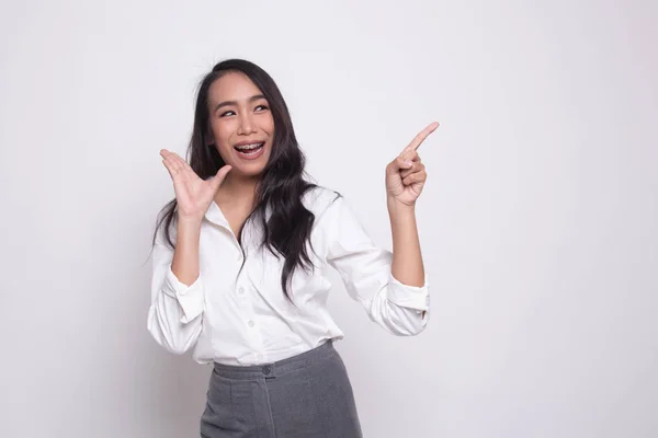 Excited Asian woman point to blank space. — Stock Photo, Image