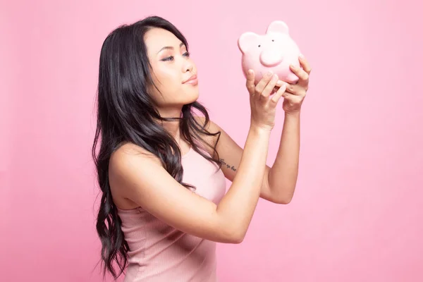 Young Asian Woman Kiss Pink Coin Bank Pink Background — Stock Photo, Image