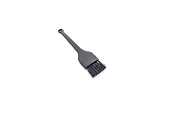 Petite brosse noire isolée sur fond blanc — Photo