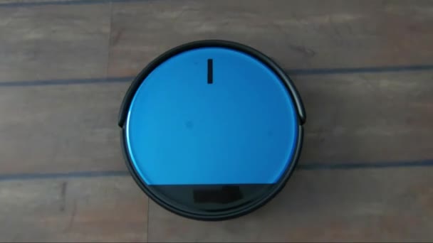 Following a robot vacuum cleaner in a room — Stock Video