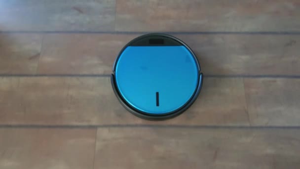Following a robot vacuum cleaner in a room — Stock Video