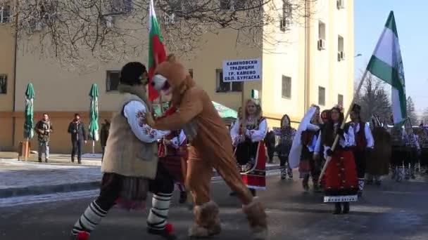 Kukeri - masked people dancing to scare evil spirits — Stock Video