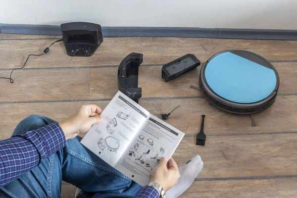 Reading the user guide for robot vacuum cleaner