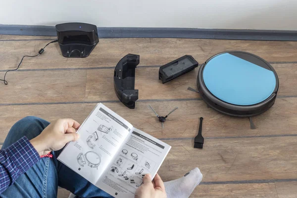 Reading the user guide for robot vacuum cleaner