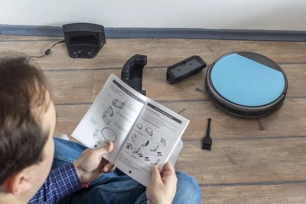 Reading the user guide for robot vacuum cleaner