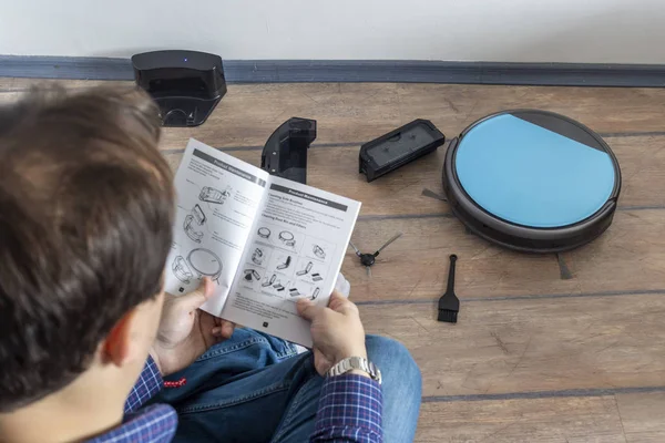 Reading the user guide for robot vacuum cleaner