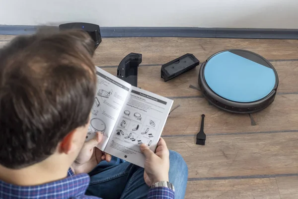 Reading the user guide for robot vacuum cleaner
