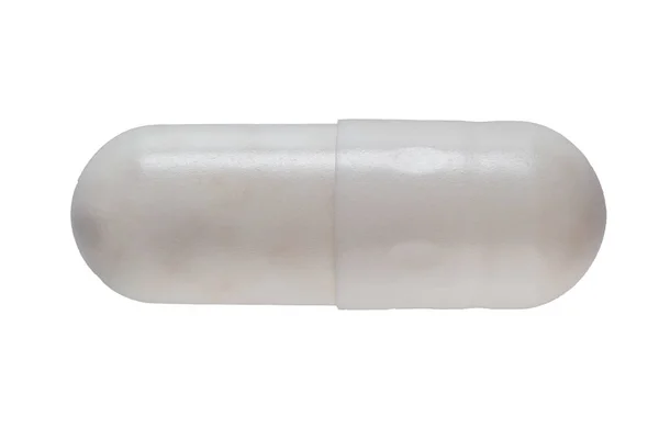 Pigułki kapsułka ekstremalne makro na białym tle — Zdjęcie stockowe