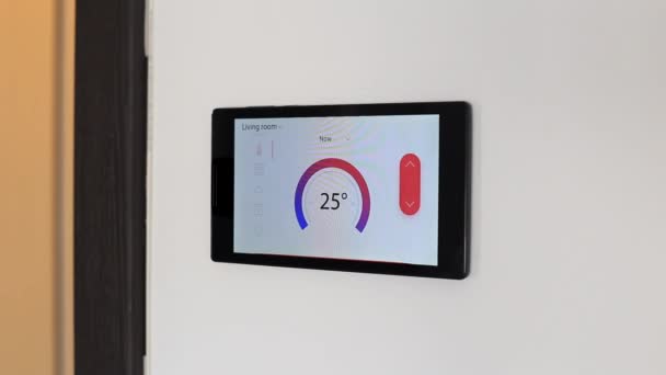 Smart home climate control device on a wall — Stock Video